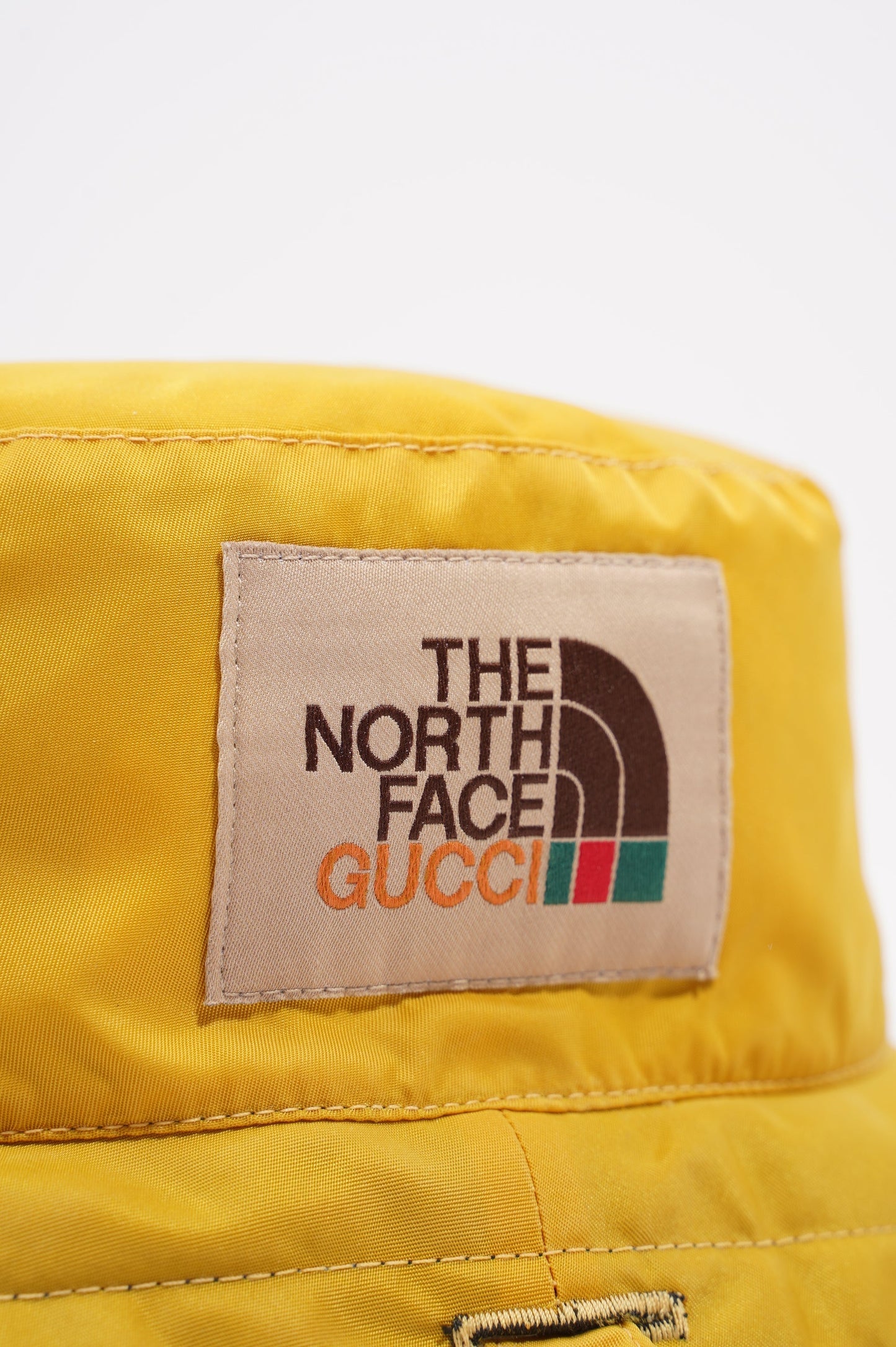 Gucci The North Face Reversible Bucket Hat Black / Yellow Nylon