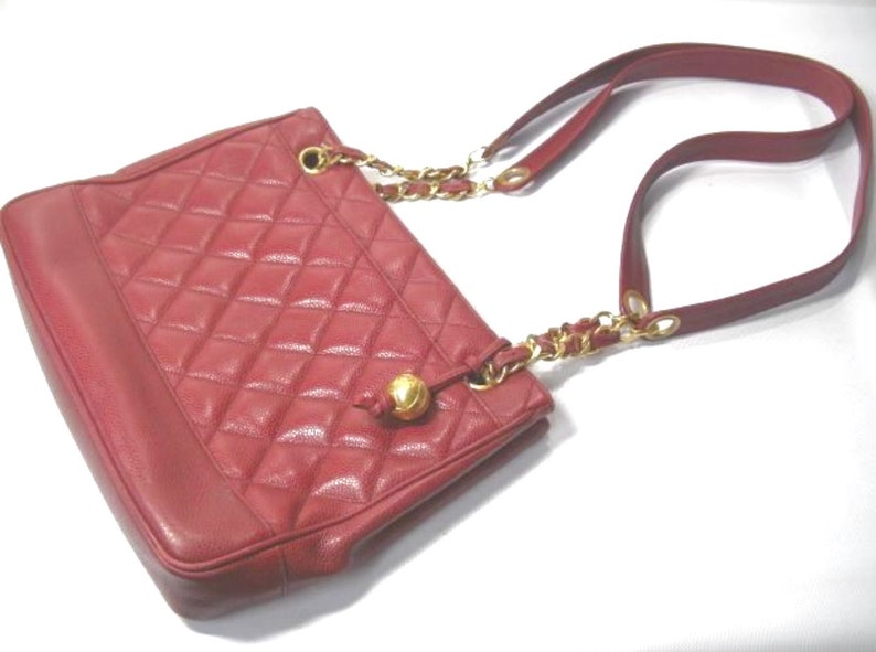 CHANEL Vintage cherry red caviar leather quilted shoulder bag, tote with golden CC ball and chain straps