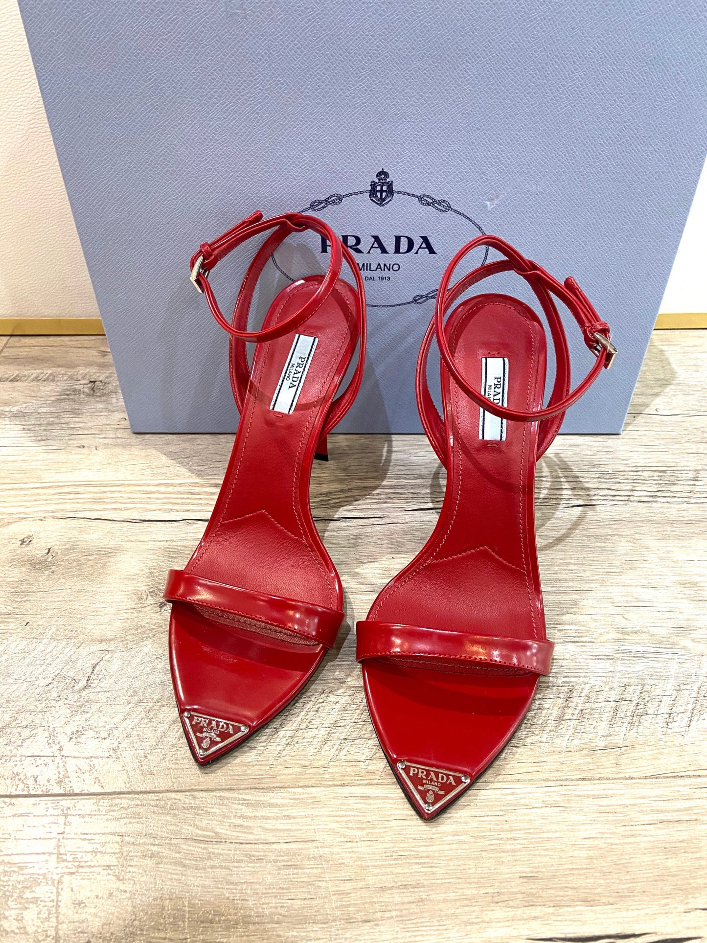 PRADA METALLIC LEATHER HIGH HEEL SANDALS IN SCARLATTO